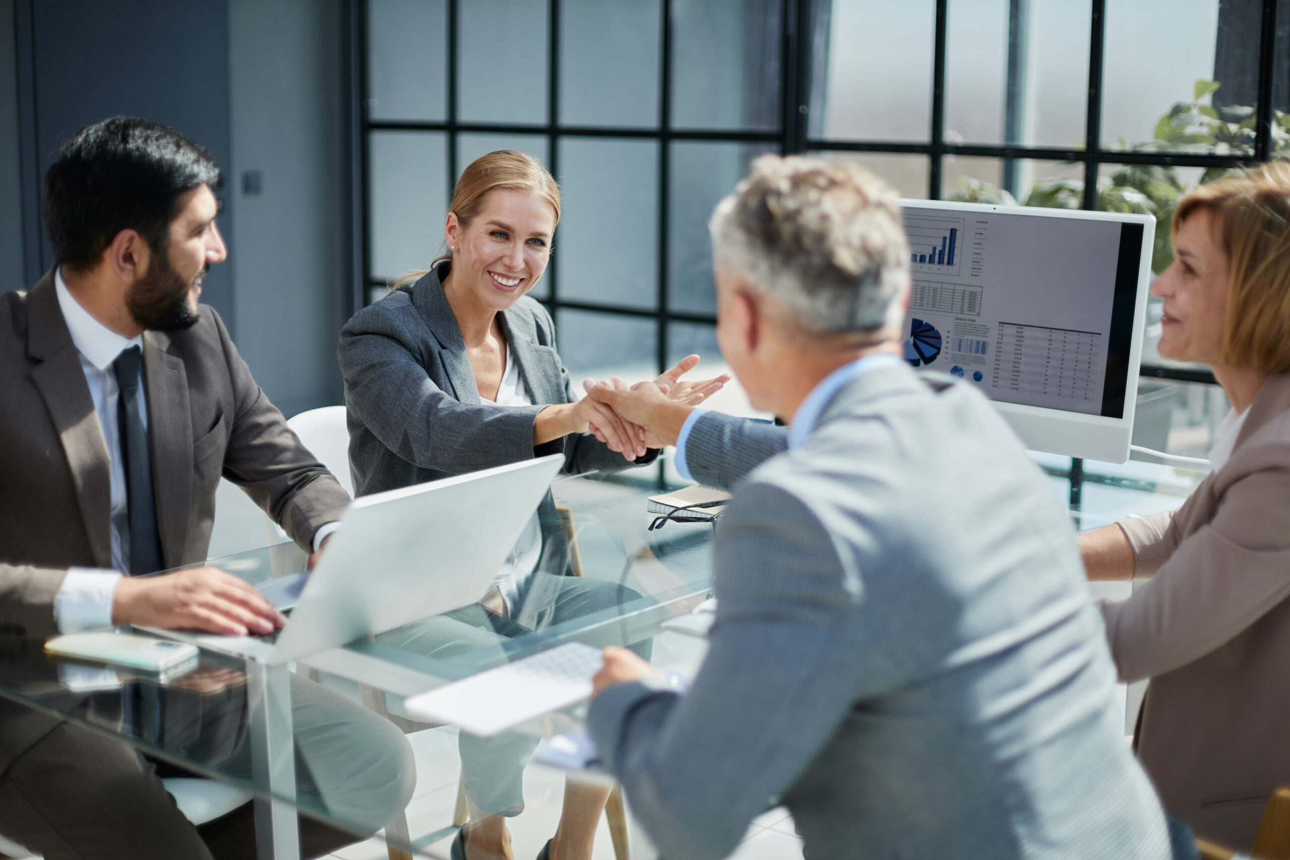 Successful diverse business team of multiethnic employees corporate portrait A group of colleagues reached an agreement in the negotiations by consolidating the deal with a handshake